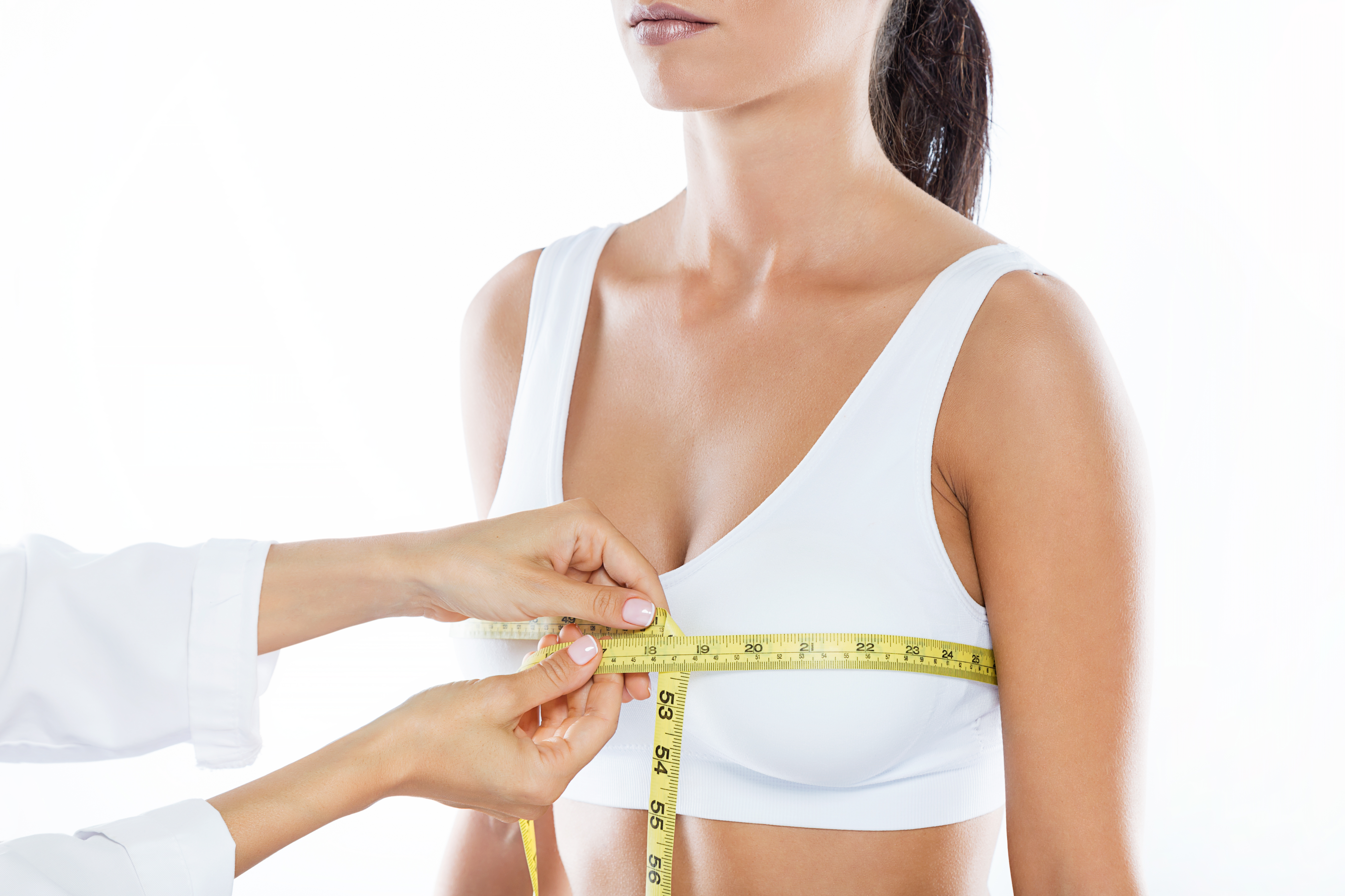 What are the reasons behind increasing the breast size of women